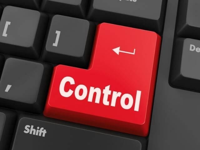 a-black-keyboard-with-red-button-labeled-control
